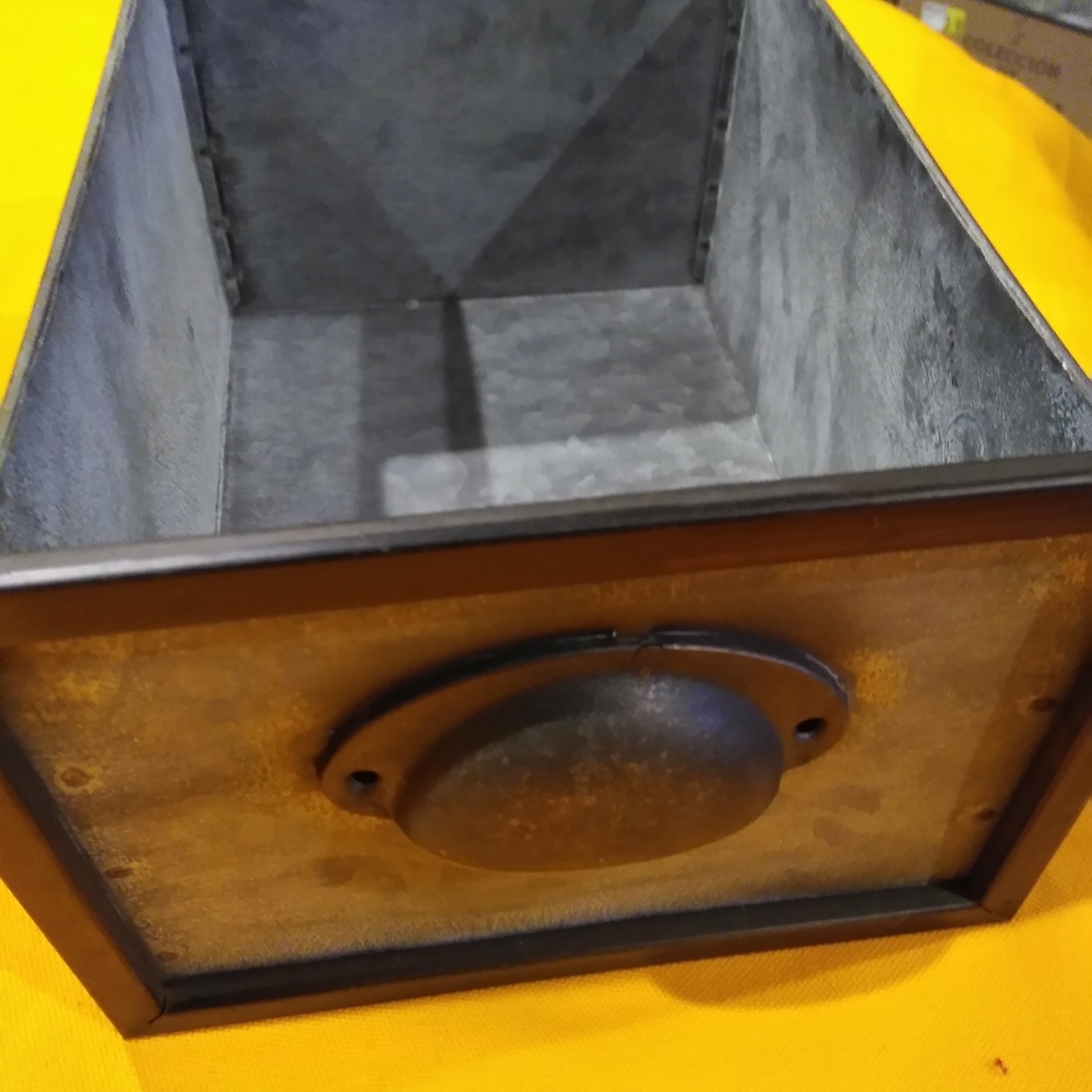 Metal storage drawer.